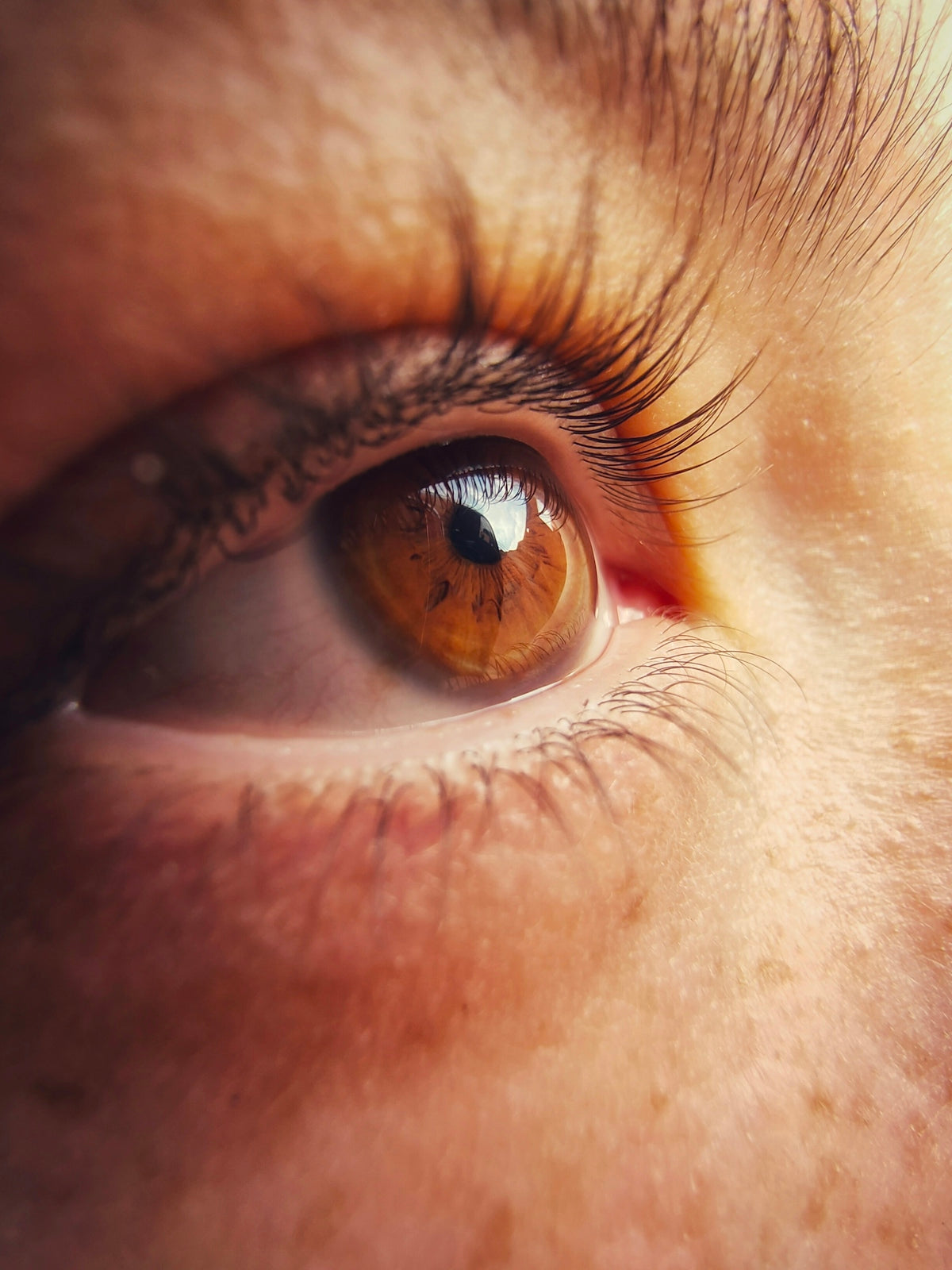 persons eye in close up photography