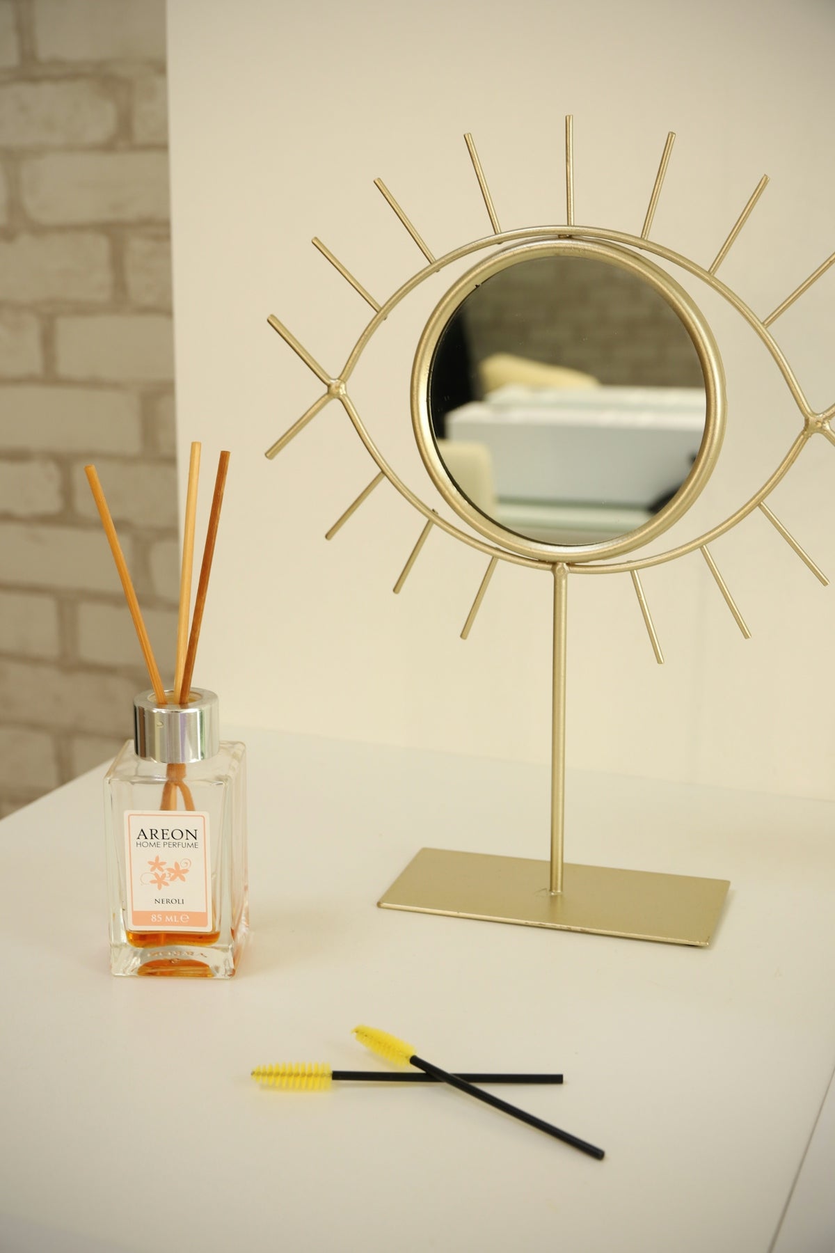 a mirror and a glass with a liquid in it